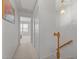 Hallway with a stairway and an open bedroom featuring lots of natural light at 3021 White Cloud Cir, Apex, NC 27502