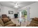 Bright living room with sliding glass doors to the patio and comfortable seating at 3021 White Cloud Cir, Apex, NC 27502