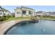 An eye-level view of the backyard pool, deck and fenced-in yard, perfect for outdoor entertainment at 329 Broad Elm Ln, Apex, NC 27523
