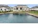 An inviting backyard pool and spa featuring a stone surround, ideal for relaxation and entertainment at 329 Broad Elm Ln, Apex, NC 27523