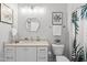 A stylish bathroom featuring a white vanity, modern fixtures, and a tropical-themed shower curtain at 329 Broad Elm Ln, Apex, NC 27523
