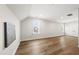 Spacious bonus room with hardwood floors, a vaulted ceiling, and plenty of natural light at 329 Broad Elm Ln, Apex, NC 27523