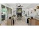 Bright living room features built-in shelving, a cozy fireplace, and large windows with plenty of natural light at 329 Broad Elm Ln, Apex, NC 27523