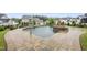 Beautiful in-ground pool with a connected jacuzzi and brick paver surround at 329 Broad Elm Ln, Apex, NC 27523