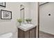Bathroom featuring a white sink vanity, modern fixtures, and neutral decor at 332 Eastfield Dr, Rocky Mount, NC 27801