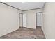 A minimalist bedroom with neutral walls features wood-look floors, a closet, and paneled doors at 332 Eastfield Dr, Rocky Mount, NC 27801