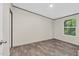 A cozy bedroom features wood-look flooring and a bright window for natural light at 332 Eastfield Dr, Rocky Mount, NC 27801