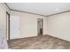 Open bedroom with modern wood-look floors and an adjoining bathroom at 332 Eastfield Dr, Rocky Mount, NC 27801