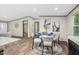 Open concept kitchen/dining area featuring a round dining table, four chairs, and an adjacent living space at 332 Eastfield Dr, Rocky Mount, NC 27801