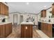 Open concept kitchen with wooden cabinets, a center island, black appliances, and neutral countertops at 332 Eastfield Dr, Rocky Mount, NC 27801