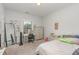 Well-lit bedroom with white furnishings, a large mirror, and ample space for personalized decor at 352 Fire Opal Ln, Holly Springs, NC 27540