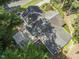An aerial perspective showcasing the home's roof, deck, and surrounding greenery at 3911 Hope Valley Rd, Durham, NC 27707