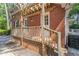 Charming brick home featuring a wooden deck with pergola, perfect for enjoying the outdoors at 3911 Hope Valley Rd, Durham, NC 27707