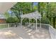 Spacious back deck with pergola, outdoor seating, and grill, ideal for outdoor dining and entertaining at 3911 Hope Valley Rd, Durham, NC 27707