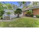Expansive backyard with a deck, lush lawn, and mature trees, creating a private and serene outdoor oasis at 3911 Hope Valley Rd, Durham, NC 27707