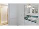 Updated bathroom with green countertop vanity and a shower in the corner at 3911 Hope Valley Rd, Durham, NC 27707