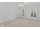 Bright bedroom with neutral carpet, a ceiling fan, and natural light from the windows at 3911 Hope Valley Rd, Durham, NC 27707