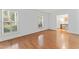 Bright, spacious room with hardwood floors, plantation shutters, and neutral color scheme at 3911 Hope Valley Rd, Durham, NC 27707