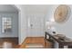 Inviting foyer featuring hardwood floors, a console table, and a view of the front door at 3911 Hope Valley Rd, Durham, NC 27707