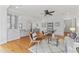 Open concept living area with hardwood floors and seamless flow to the kitchen and dining space at 3911 Hope Valley Rd, Durham, NC 27707