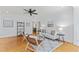 Bright living room with hardwood floors, neutral decor, and comfortable seating arrangement at 3911 Hope Valley Rd, Durham, NC 27707