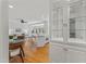 Bright open living space with kitchen in the background, plenty of light and beautiful hardwoods at 3911 Hope Valley Rd, Durham, NC 27707