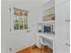Cozy home office featuring built-in shelves, a desk, and a window with lots of natural light at 3911 Hope Valley Rd, Durham, NC 27707