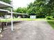Spacious backyard featuring a covered area, a utility shed, and ample space for outdoor activities and storage at 404 Oakgrove Dr, Graham, NC 27253