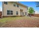 Backyard with wooden fence and outdoor seating area at 404 Straywhite Ave, Apex, NC 27539