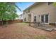 Spacious backyard featuring a patio with outdoor seating, perfect for entertaining at 404 Straywhite Ave, Apex, NC 27539