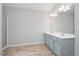 Bathroom featuring a double vanity with ample counter space and modern fixtures at 404 Straywhite Ave, Apex, NC 27539