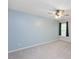 Spacious bedroom with a ceiling fan and a window that allows ample natural light at 404 Straywhite Ave, Apex, NC 27539