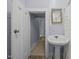 This bathroom has a classic sink with a mirror and a shower with a curtain at 421 E Morehead St, Burlington, NC 27215