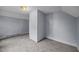 Corner bedroom with neutral carpeting, light walls, and ample natural light at 421 E Morehead St, Burlington, NC 27215