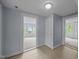 Bright bedroom with freshly painted walls and two entry points to the space at 421 E Morehead St, Burlington, NC 27215