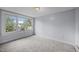 Spacious bedroom with carpet, fresh paint, and a large window with views of neighborhood at 421 E Morehead St, Burlington, NC 27215