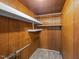 Walk-in closet showcasing shelving and wooden paneled walls at 421 E Morehead St, Burlington, NC 27215