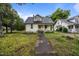 A charming two-story house with a traditional architectural design and quaint front porch at 421 E Morehead St, Burlington, NC 27215