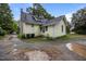 Charming two-story house featuring classic design, gabled roof and spacious backyard area at 421 E Morehead St, Burlington, NC 27215