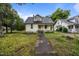 A charming two-story house with a traditional architectural design and quaint front porch at 421 E Morehead St, Burlington, NC 27215