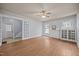 The spacious living room features hardwood floors, crown molding, ceiling fan, and built-in bookshelves at 421 E Morehead St, Burlington, NC 27215