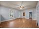 Spacious living room featuring beautiful hardwood floors, crown molding and ceiling fan at 421 E Morehead St, Burlington, NC 27215