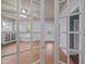 Bright living room with beautiful wood floors and view of the adjacent rooms at 421 E Morehead St, Burlington, NC 27215