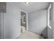 View of the sunroom with light blue wooden paneling and entrance to adjacent room at 421 E Morehead St, Burlington, NC 27215