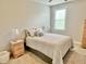Bright bedroom with plush bedding, decorative pillows and window with natural light at 4562 Brighton Ridge Dr, Apex, NC 27539
