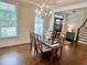 Elegant dining room featuring hardwood floors, a chandelier, and a table with chairs at 4562 Brighton Ridge Dr, Apex, NC 27539
