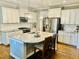 Modern kitchen featuring granite countertops, stainless steel appliances, and an island with seating at 4562 Brighton Ridge Dr, Apex, NC 27539