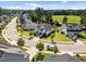 An aerial view of a modern, suburban neighborhood featuring well-manicured lawns and varied home styles at 461 Cedar Pond Ct, Knightdale, NC 27545