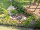 Overhead view of the serene backyard garden with stone patio and mature landscaping at 461 Cedar Pond Ct, Knightdale, NC 27545