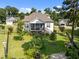 Aerial view of the home's backyard and deck showing an abundance of green space and landscaping at 461 Cedar Pond Ct, Knightdale, NC 27545